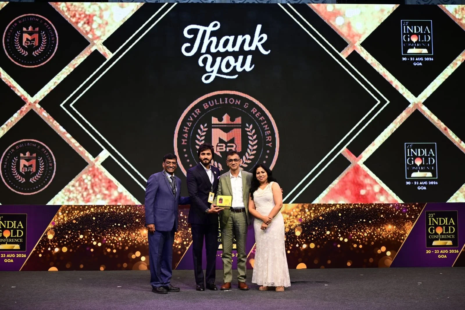 Group with a gold award at an India Gold Conference ceremony