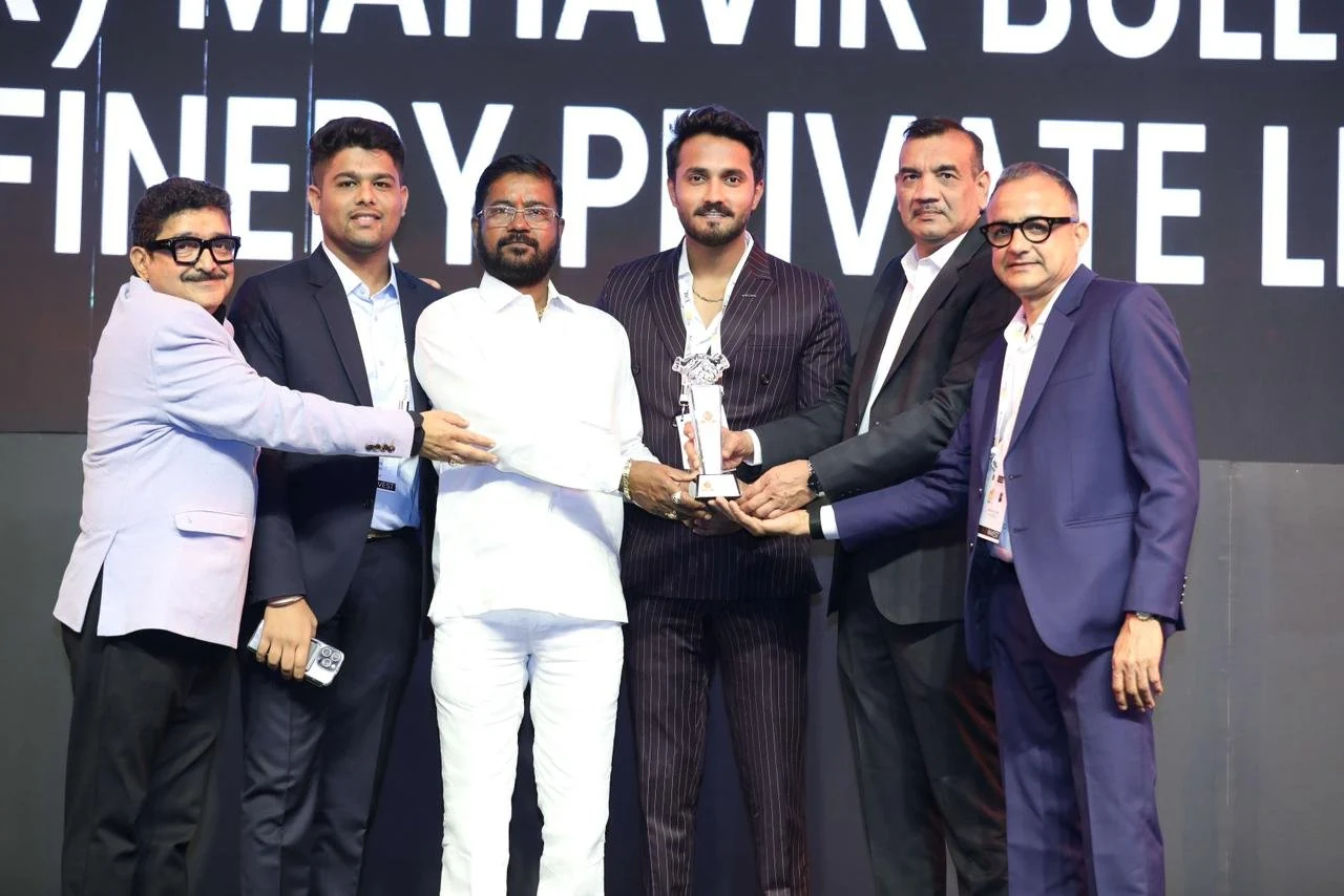 Group holding the IIBS award on stage
